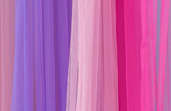 Migration inhibitor textile dyeing